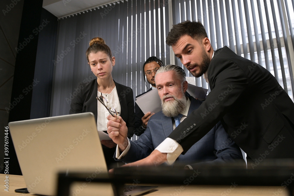 Employees actively discuss work issues in the manager's office Employees actively discuss work issues in the manager's office