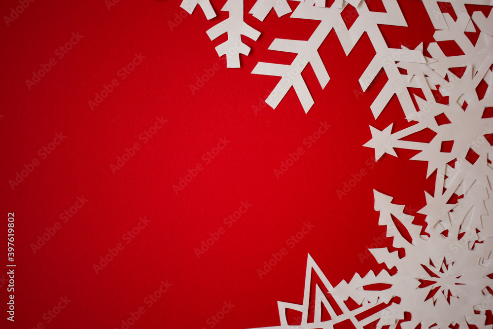 Red background with paper snowflakes. Christmas concept background Red background with paper snowflakes. Christmas concept background