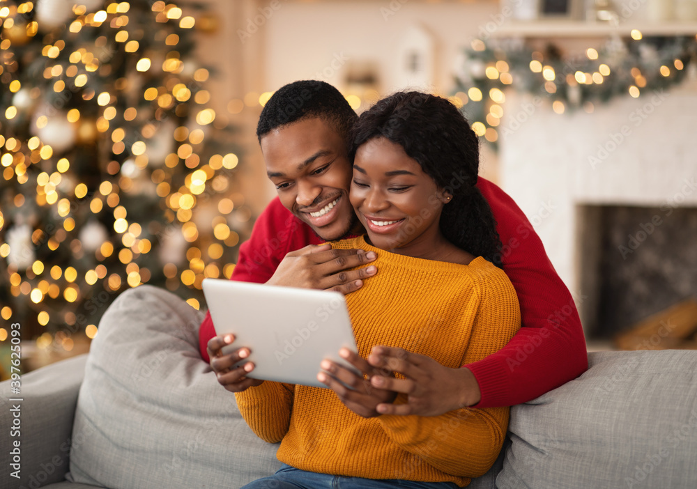Family happy millennial african american husband and wife look at ...