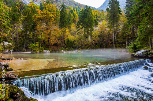  Autumn forest. Artificial waterfall