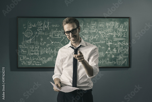 Confident math professor pointing at camera