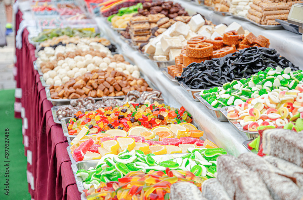 Fototapeta premium Sweets and candy on the counter market.