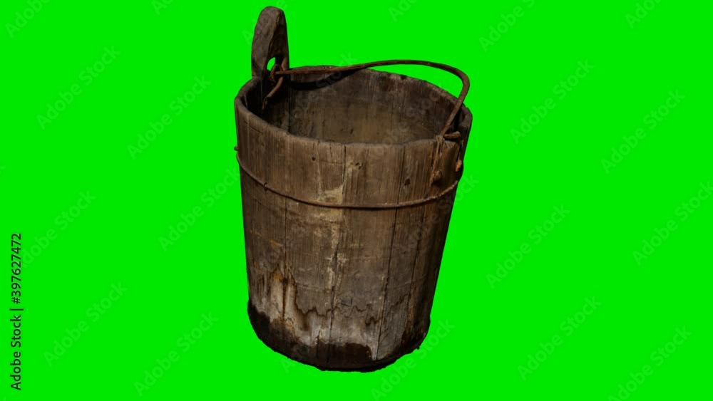 Old traditional wood bucket at green chromakey background Old traditional wood bucket at green chromakey background