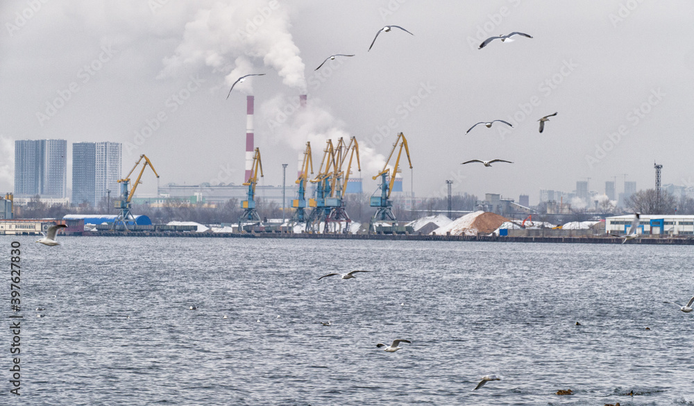 River port with cranes and pipes in Moscow