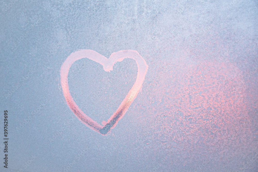 Heart drawing on a frozen window