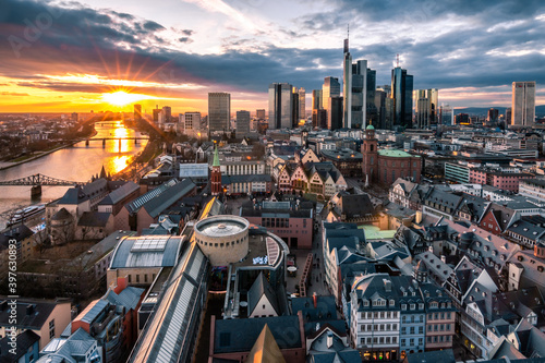 Frankfuert is the only skyline in Germany. backlit photography for sunset with a great sky and lighting in the houses. High-rise buildings, city recording and finance