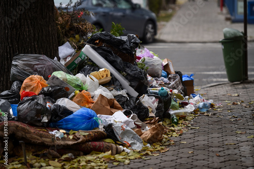 Slika na platnu Piles of household waste are abandoned on the streets of Bucharest