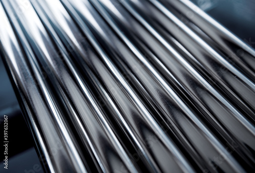 Abstract background of steel pipes stacked on a pallet photo