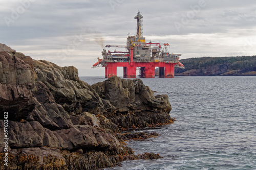 Deep water drill rig is moored near shore after finishing an exploration well, Newfoundland and Labrador, Canada.