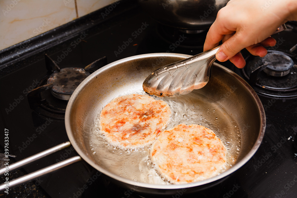 Frying the burgers in the turkey breast burger pan Frying the burgers in the turkey breast burger pan