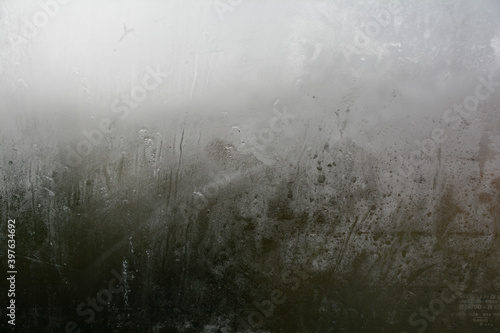 Looking through the glass of the car during a thunderstorm in autumn, in the background Italian countryside