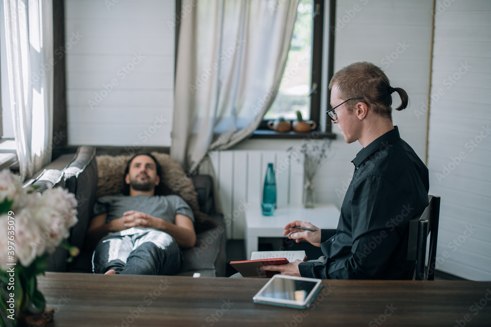 Psychotherapist and patient at an appointment in the office Psychotherapist and patient at an appointment in the office