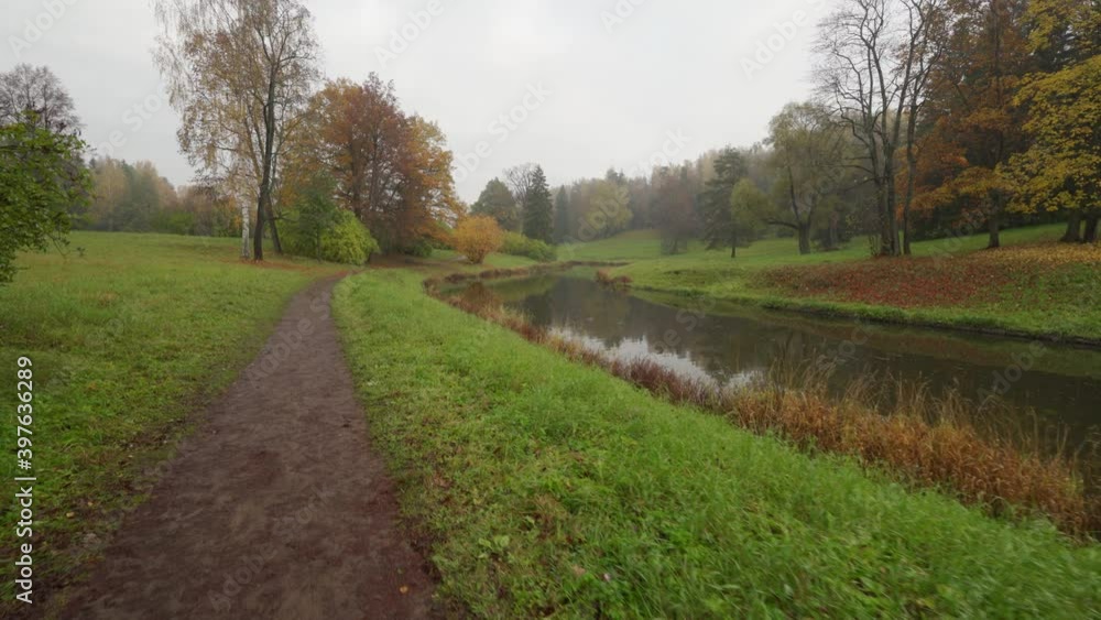 Walking on the path in magic Pavlovsk Park, morning autumn landscape, St. Petersburg, Russia. Walking on the path in magic Pavlovsk Park, morning autumn landscape, St. Petersburg, Russia.