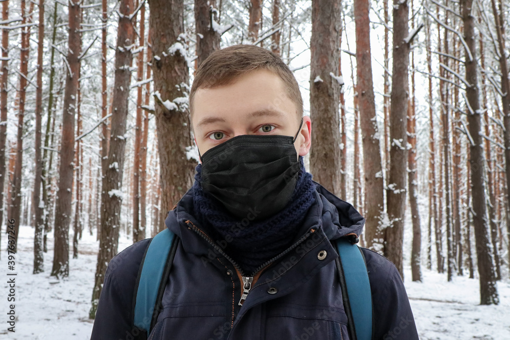 A man in a protective mask. Forest area. Conifer. A man in a protective mask. Forest area. Conifer.