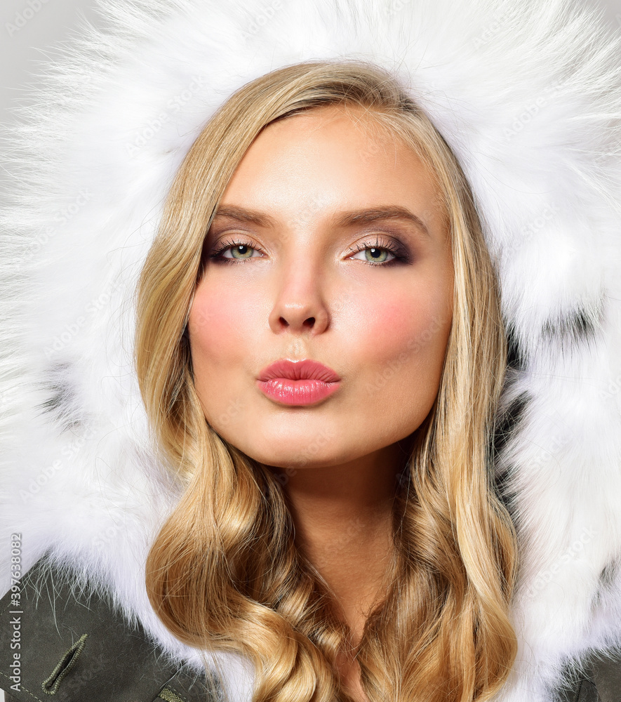 Beautiful girl in a fur coat. Beauty Fashion Model Girl. Luxury Winter Woman. Sends Air kiss Beautiful girl in a fur coat. Beauty Fashion Model Girl. Luxury Winter Woman. Sends Air kiss
