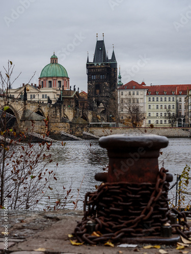 View on Prague's Old Town from Kampa Island across the Vltava River on an autumn evening