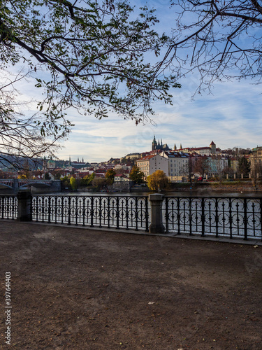 View on Prague Castle and Lesser Town from across the Vltava River on an autumn evening