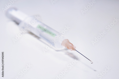 injection with corona, COVID-19 vaccine, extreme close up, free copy space, symbol picture