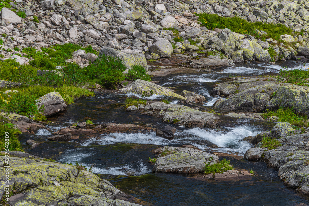 Beautiful river with crystal clear water among fall forest Beautiful river with crystal clear water among fall forest