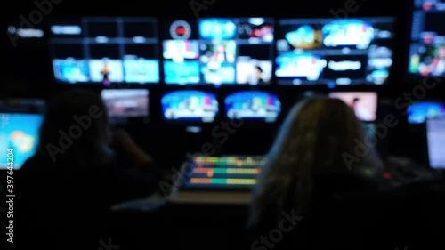 Newsroom Background for News Broadcasts. Professional sound engineer's console. Television Broadcast, working with video and audio mixer, control broadcast in recording studio. blurred background. photo