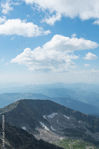 Panoramic view of mountain ranges. Rock ridge with various peaks for rock climbing