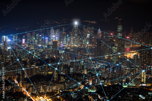 Smart city and connection lines. Cityscape of Hong Kong, China, at night. Technology, network connection, information and smart city concept.