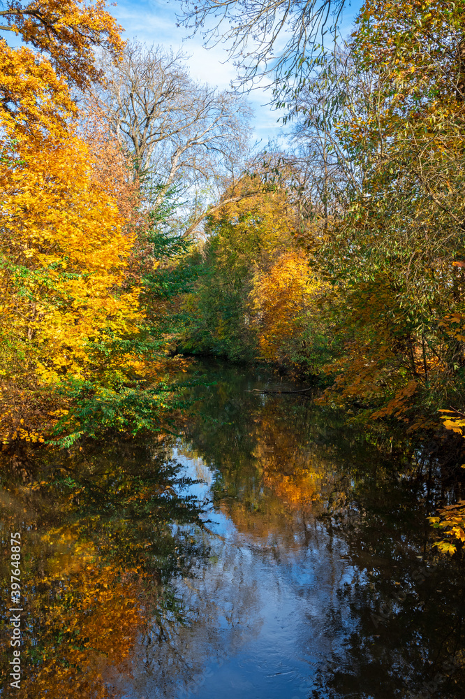 Autumn scenic with trees reflections in a river Autumn scenic with trees reflections in a river