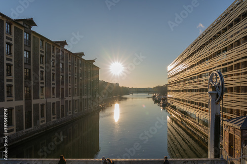 Paris, France - 12 28 2019: View of the Ourcq canal form the lift bridge at sunset photo