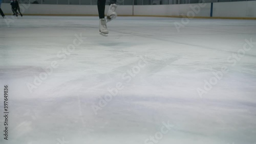 Young woman desperately stands up after falling on ice
