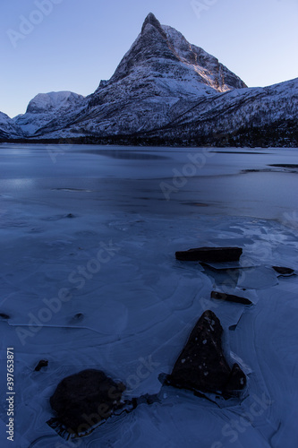 frozen lake inder moutain in Innerdalen Norway © Mrio