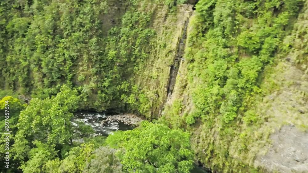 Stunning aerial shot of a tropical canyon above the river with thick vegetation Stunning aerial shot of a tropical canyon above the river with thick vegetation