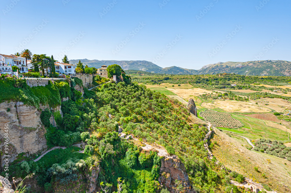 Rural area with olive trees plantations as seen from hills of town of Ronda in Andalusia, Spain