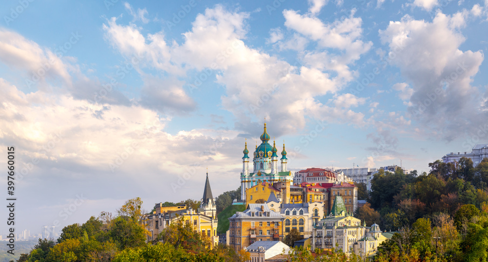 Amazing panoramic view of the slopes above the Dnieper in Kyiv, Ukraine. The ancient Baroque St. Andrew's Church rises above Andriyivskyy Uzviz and Vozdvyzhenka.