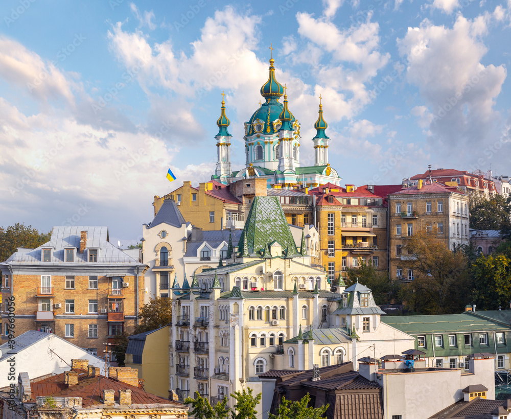 Amazing panoramic view of the slopes above the Dnieper in Kyiv, Ukraine. The ancient Baroque St. Andrew's Church rises above Andriyivskyy Uzviz and Vozdvyzhenka.