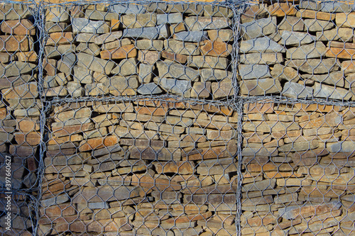 stones laid in an iron grid