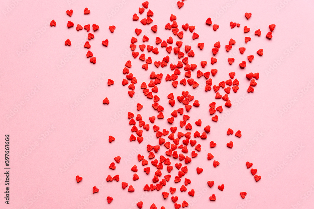 sprinkles background, sugar sprinkle red hearts, decoration for cake and bakery. Top view, flat lay. Valentines holiday