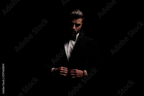 Tablou pe pânză elegant fashion man closing black velvet tuxedo