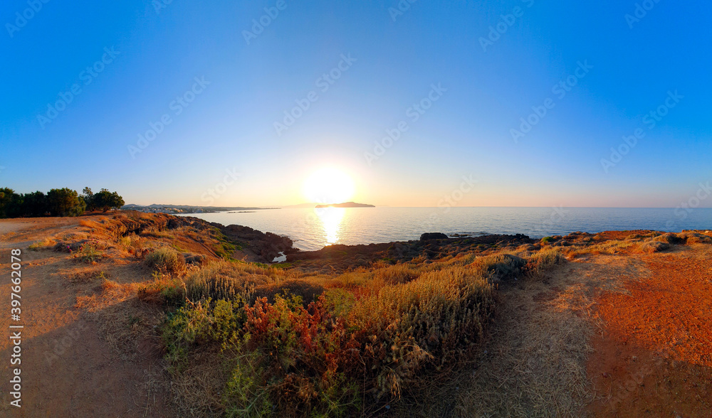 Colorful sunset over the water on Crete, Greece. Colorful sunset over the water on Crete, Greece.