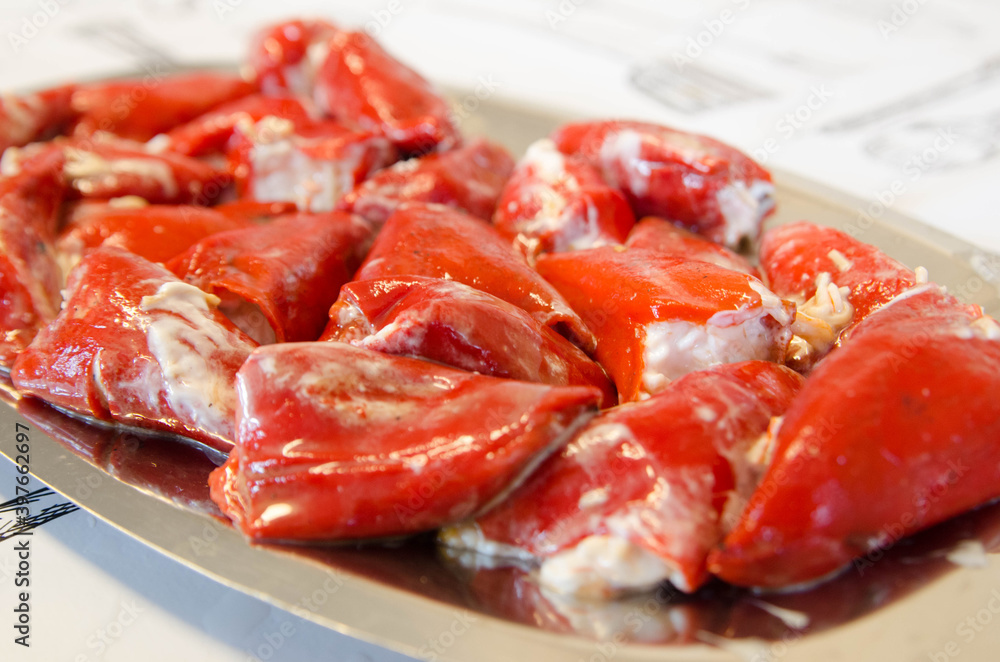 Delicious homemade stuffed peppers. Red peppers stuffed with mayonnaise and cod.