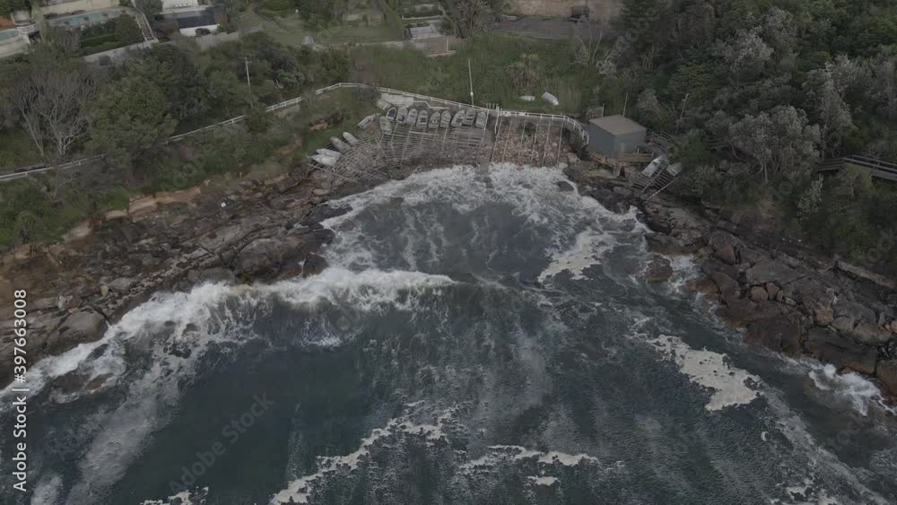 Boats Docked At Gordon's Bay NSW - Secluded Beach In Sydney, Australia - drone pullback (ascending) Boats Docked At Gordon's Bay NSW - Secluded Beach In Sydney, Australia - drone pullback (ascending)