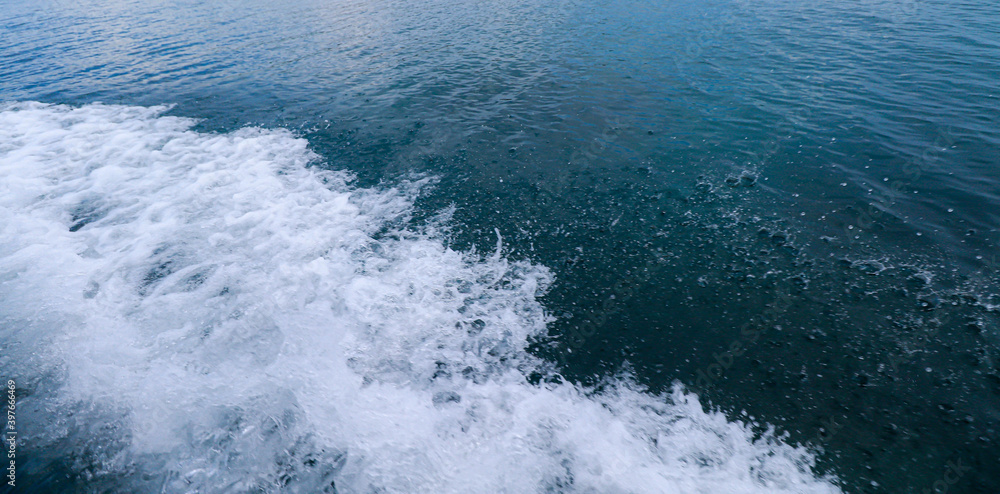 Fototapeta premium waves and foam on the blue sea