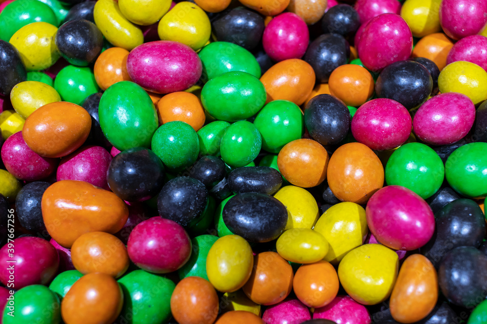 Nut candy dragees covered with colorful glaze. Nut candy dragees covered with colorful glaze.
