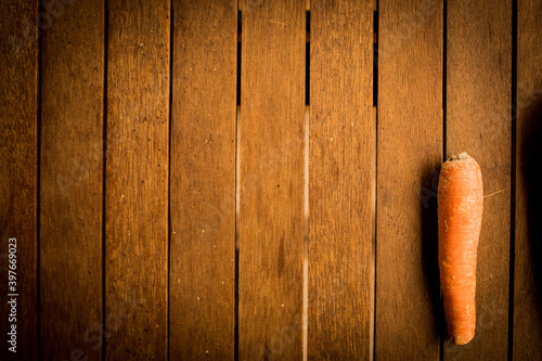 orannge carrots on wood background photo