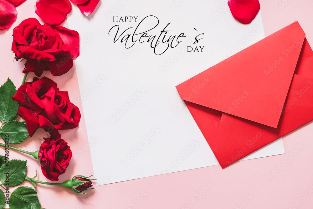 Congratulations with text Happy Valentine's Day. Red envelope for handwritten letter and red roses on white background. Copy space. Flat lay.