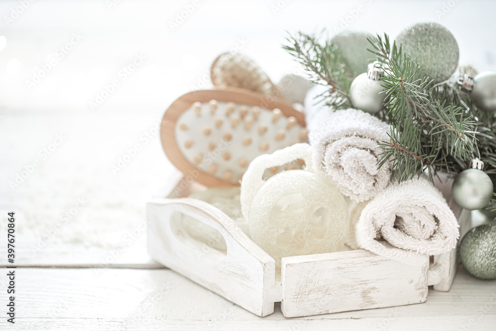 Spa composition with Christmas decoration on light blurred background close up.