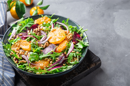 Tangerine and beet salad with arugula, walnuts and pine nuts