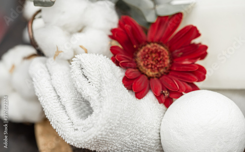 Spa composition with bath accessories and flower close up.