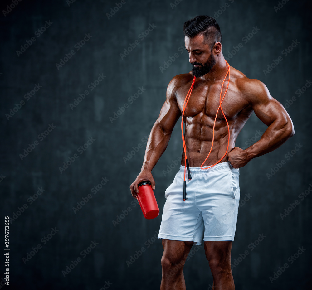 Nutritional Supplement. Muscular Men Drinks Protein, Energy Drink After