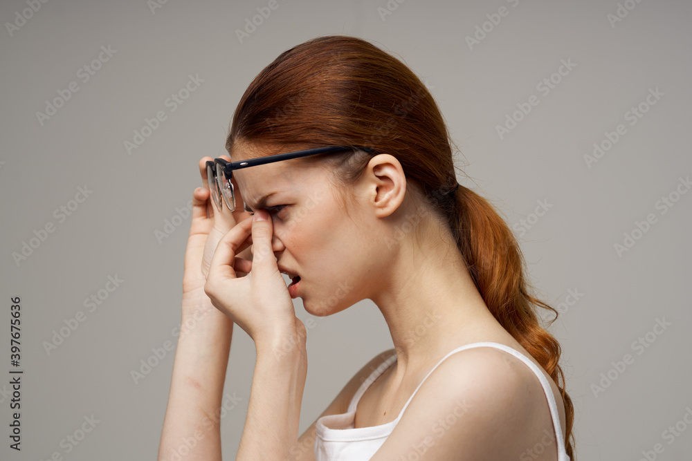 red-haired woman with glasses vision problems fatigue negative red-haired woman with glasses vision problems fatigue negative