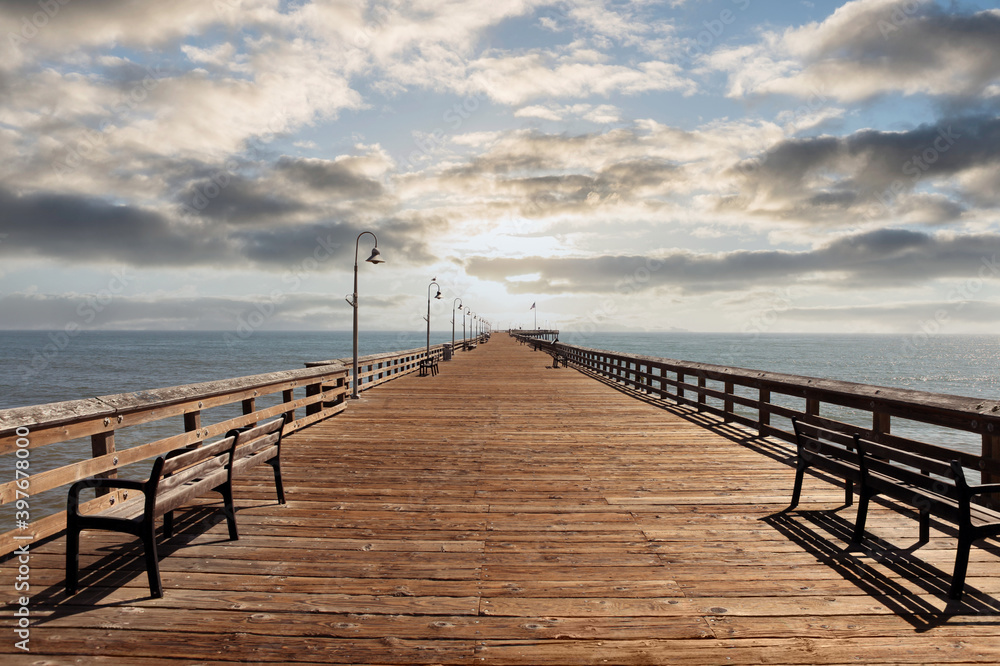 View of historic Ventura pier with sunset sky near Los Angeles, California. 